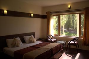 Postel nebo postele na pokoji v ubytování Ladakh Himalayan Retreat