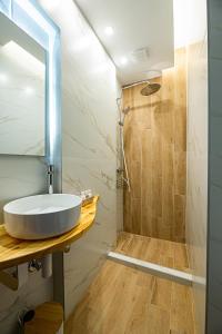 a bathroom with a sink and a shower at Venus in Thessaloniki