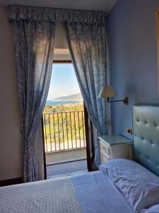 Postel nebo postele na pokoji v ubytování Hotel Hermitage