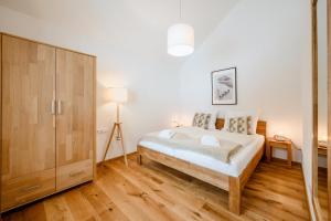 Postel nebo postele na pokoji v ubytování Da Alois - Alpine Premium Apartments