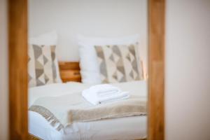 Postel nebo postele na pokoji v ubytování Da Alois - Alpine Premium Apartments