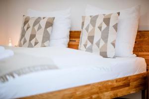 Postel nebo postele na pokoji v ubytování Da Alois - Alpine Premium Apartments