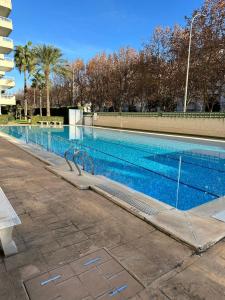 Bazén v ubytování Precioso apartamento con piscina nebo v jeho okolí