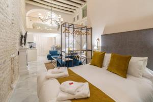 Postel nebo postele na pokoji v ubytování Judería de Sevilla II - Luxury Apartments