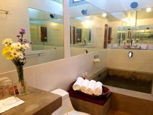 a bathroom with a sink and a toilet and a mirror at Nest Bar Casita, Granada in Granada +24 photos