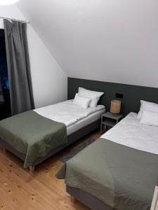 Postel nebo postele na pokoji v ubytování Chatki Między Górami