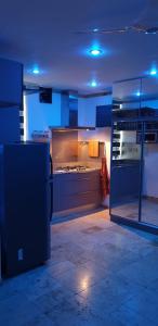 a kitchen with a stove top oven in a room at 5 star Smart studio 30m2 in Flic-en-Flac