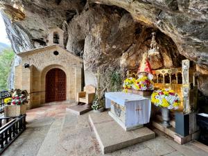 a church in a cave with a church inside at El Jornu in Dego