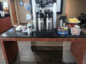 a table in a hotel room with a counter top at Red Roof Inn Prattville in Prattville