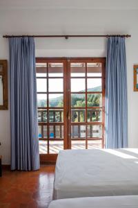 Postel nebo postele na pokoji v ubytování Hotel Tugasa Las Truchas