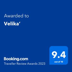 a blue screen with the text awarded to vilaria traveler review awards at Velika’ in Eden Park