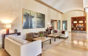 a large living room with couches and tables at NH Collection Palacio de Burgos in Burgos