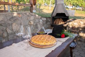 a table with a cake and wine glasses on it at Holiday home in Metlika Kranjska Krain 26051 in Metlika