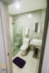 a bathroom with a toilet and a sink and a shower at 3010 Habitación en Pacifika, excelente ubicación in Mazatlán
