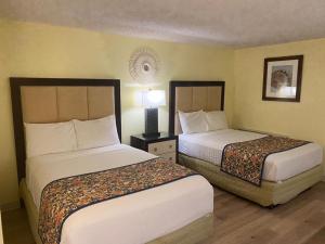 Ein Bett oder Betten in einem Zimmer der Unterkunft OK Hotel
