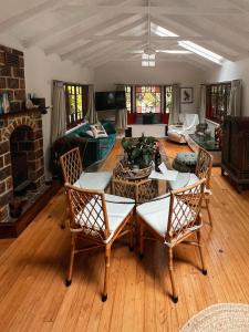 a living room with a table and chairs at Sanctuary in The Pocket in The Pocket