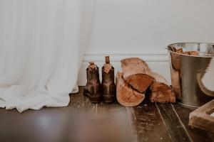 a group of shoes and a bucket on a table at The Postman's Cottage - Hinterland Luxury in Montville