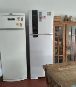 O bucătărie sau chicinetă la Quarto em casa compartilhada