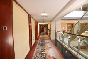 a corridor in a building with a glass floor at Yiwu Ocean Hotel - Original Best Western Premier Ocean Hotel in Yiwu