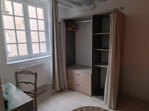 Posteľ alebo postele v izbe v ubytovaní Le logis de la rue des Arts
