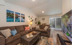 a living room with a couch and a table at Modern and Stylish KING bed Wifi FREE Parking in Spokane Valley