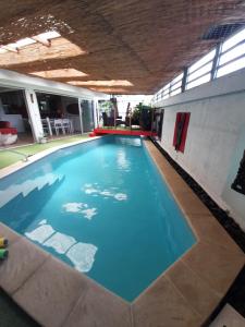 a large swimming pool in a building at Alain in Noumea