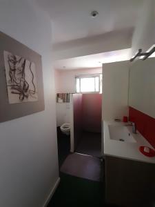 a bathroom with a sink and a toilet at Alain in Noumea