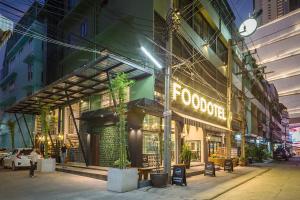 a building with a sign on the side of it at FOODOTEL in Bangkok