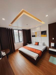 Postel nebo postele na pokoji v ubytování DT Hotel Hai Phong