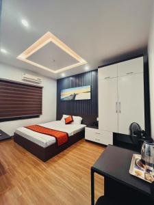 Postel nebo postele na pokoji v ubytování DT Hotel Hai Phong
