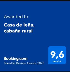 Ett certifikat, pris eller annat dokument som visas upp på Casa de leña, cabaña rural