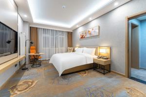 Voodi või voodid majutusasutuse Joy Fall Hotel toas