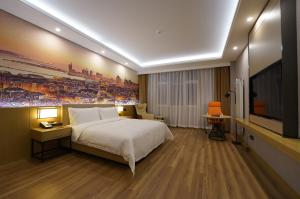 Voodi või voodid majutusasutuse Joy Fall Hotel toas