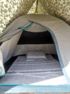 a tent with two beds inside of it at El Nido Beach Camp 