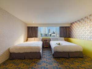 Voodi või voodid majutusasutuse LaVita Hotel toas