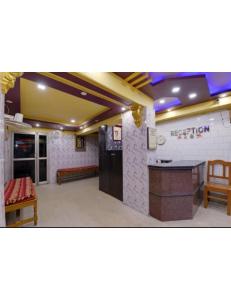 a lobby of a restaurant with a counter and a bar at Alankar Lodge, Karagpur in Kharagpur