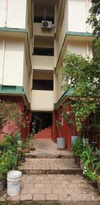 an empty courtyard of a building with plants at 2 Bhk Holiday home near Panjim city & Beaches in Panaji