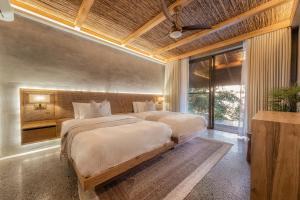 Rúm í herbergi á Manami Resort