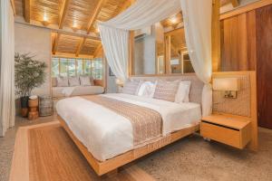 Rúm í herbergi á Manami Resort