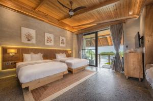 Rúm í herbergi á Manami Resort