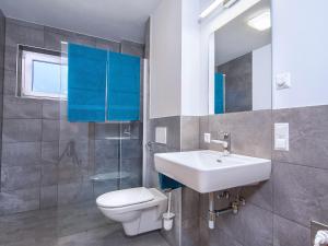 Koupelna v ubytování Apartment in Neukirchen by Wildkogelbahn + 18 fotografií