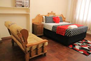 Un pat sau paturi într-o cameră la Wampex guest house