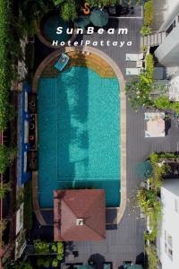 an overhead view of a swimming pool in a building at Sunbeam Hotel Pattaya - SHA Extra Plus in Pattaya