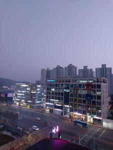 a city at night with a lot of buildings at Again in Daejeon