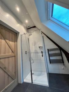 a bathroom with a shower in a attic at De Haven in Zierikzee