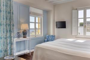Cama ou camas em um quarto em Dorion Hotel