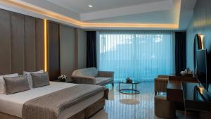 Postel nebo postele na pokoji v ubytování Vogue Hotel Supreme Bodrum