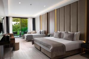 Postel nebo postele na pokoji v ubytování Vogue Hotel Supreme Bodrum