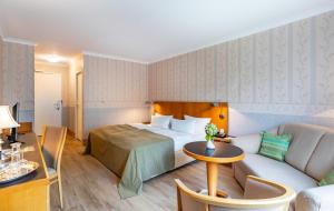 Postel nebo postele na pokoji v ubytování Parkhotel Görlitz