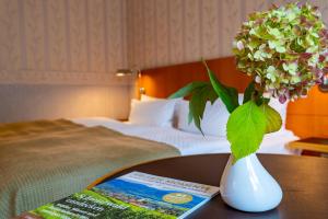Postel nebo postele na pokoji v ubytování Parkhotel Görlitz